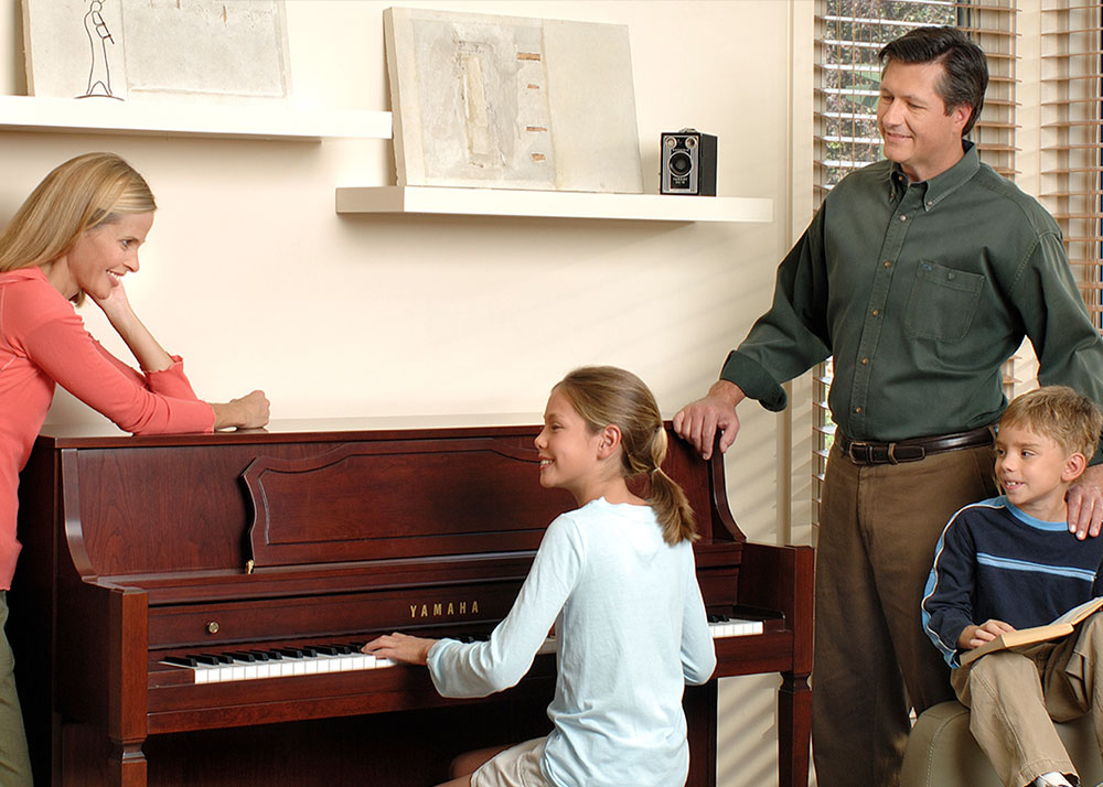 Family with an upright piano